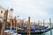 Gondolas floating on the Grand Canal on a quiet day of spring, Venice, Italy