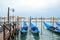 Gondolas floating on the Grand Canal on a quiet day of spring, Venice, Italy