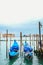 Gondolas floating on the Grand Canal on a quiet day of spring, Venice, Italy