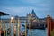 Gondolas moored on the bank of Grand Canal in Venice, Italy