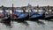 Gondolas parked near Grand Canal shore. Venice, Italy