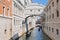 Gondolas passing over Bridge of Sighs, Ponte dei Sospiri Venice Italy.