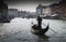 Gondolas sail along the Canal Grande. Gondola is the most attractive tourist transport in Venice. Romantic water trip on