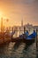 Gondolas by Saint Mark square during sunrise