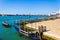 Gondolas station blue lagoon Venice waterfront Italy