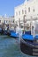 Gondolas - symbol of Venice, at the port before Doge`s Palace, Venice, Italy