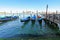 Gondolas at their moorings in the evening in Venice, Italy