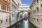 Gondolas with tourists sailing along the Palace Channel Rio di Palazzo. Venice