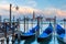 Gondolas at twilight in Venice lagoon, Italia