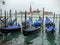 Gondolas in Venice in a rainy day. Italy.