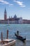 Gondolier against San Giorgio island in Venice, Italy