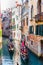 Gondolier carries tourists on gondola