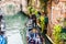 Gondolier carries tourists on gondola