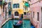 Gondolier carries tourists on gondola