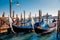 Gondolier carries tourists gondola Grand Canal of Venice, Italy.