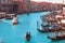 Gondolier carries tourists on gondola Grand Canal of Venice, Italy