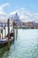 A gondolier drives a gondola with tourists on board near Santa Maria Della Salute in Venice