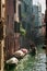 Gondolier Floating in a canal in Venice