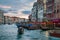 Gondolier floating near restaurants in Venice