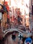 Gondolier floats on the narrow channel in Venice, Italy