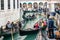 Gondolier on a gondola on canal street in Venice, Italy