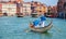 Gondolier gondola on Grand canal Venice italy