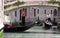Gondolier, gondola and tourists in Venice