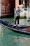 Gondolier on the grand canal, Venice Italy