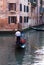 Gondolier in Quiet Venice Canal