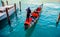 Gondolier in straw hat goes on paddle ship trip with passengers, next to blue water moored white boat venice.