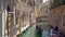 Gondoliers at narrow canal in Venice