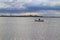 Gone fishing man on boat on draycote water reservoir in warwickshire