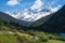 Gongga mountain and pine tree forest in Mugecuo national park, Kangding, Himalaya mountains range in Sichuan, China