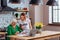 Good-appealing assistant helping aged granny to sign documents