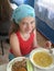 Good appetite for children in the summer camp, relax and dine together. Cute baby girl.