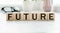 Good or bad future symbol. Turned wooden cubes and changed concept words Bad future to Good future. Beautiful white table white