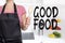 Good food cook holding wooden spoon background concept