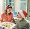 Good food and the perfect company to go with it. a beautiful young couple dishing up food together at a Christmas lunch