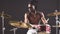 Good-looking artistic african black male drummer enjoying playing drums