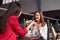 Good-looking females telling funny stories while enjoying coffee