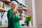 Good-looking grandmother feasting eyes with family picture in frame