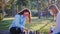 Good looking ladies with a protective mask playing on a chess game in the middle of the park in the pandemic of Covid-19