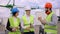 Good looking man businessman his assistant and architect analyzing the next plan of construction site on the roof top of