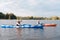 Good-looking man and woman looking happy while kayaking