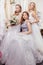 Good-looking three women together in wedding dresses