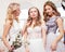 Good-looking three women together in wedding dresses