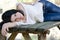 Good looking woman lie on a wooden table