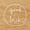 Good luck hand drawn lettering on brown crumpled paper