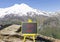Good luck symbol. Concept words Good luck on beautiful black chalk blackboard. Beautiful mountain Elbrus blue sky background.