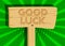 Good luck. Wishing success text on Wooden sign.